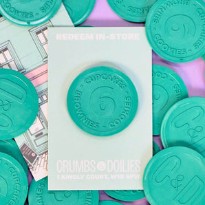 Soho Gift Token made from recycled nets redeemable for 6 cupcakes, brownies, or cookies at Crumbs & Doilies Soho.